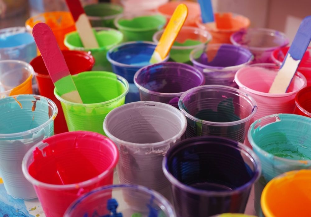 Mix of different paint colours in pots