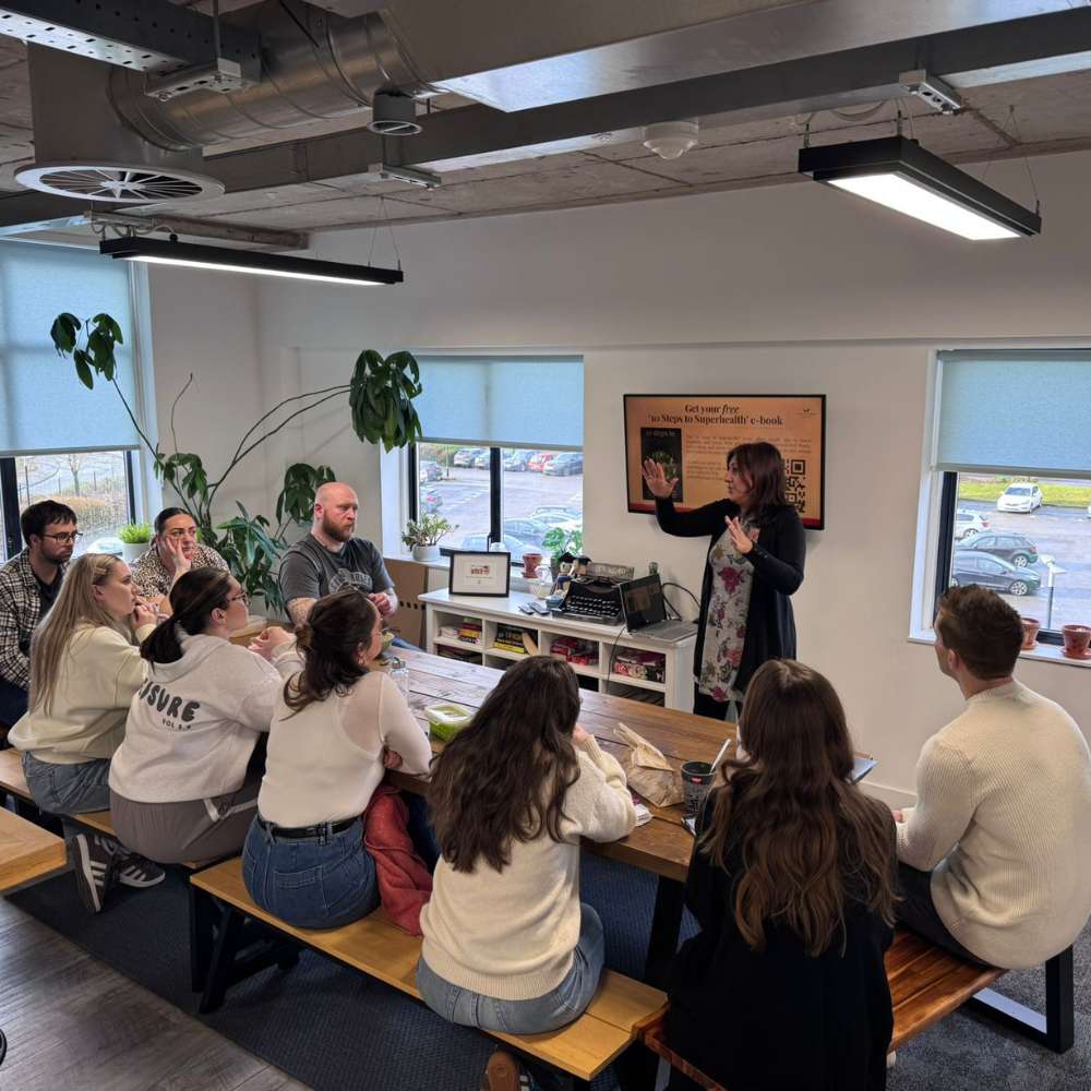 The team sitting while they're presented the latest lunch and learn session